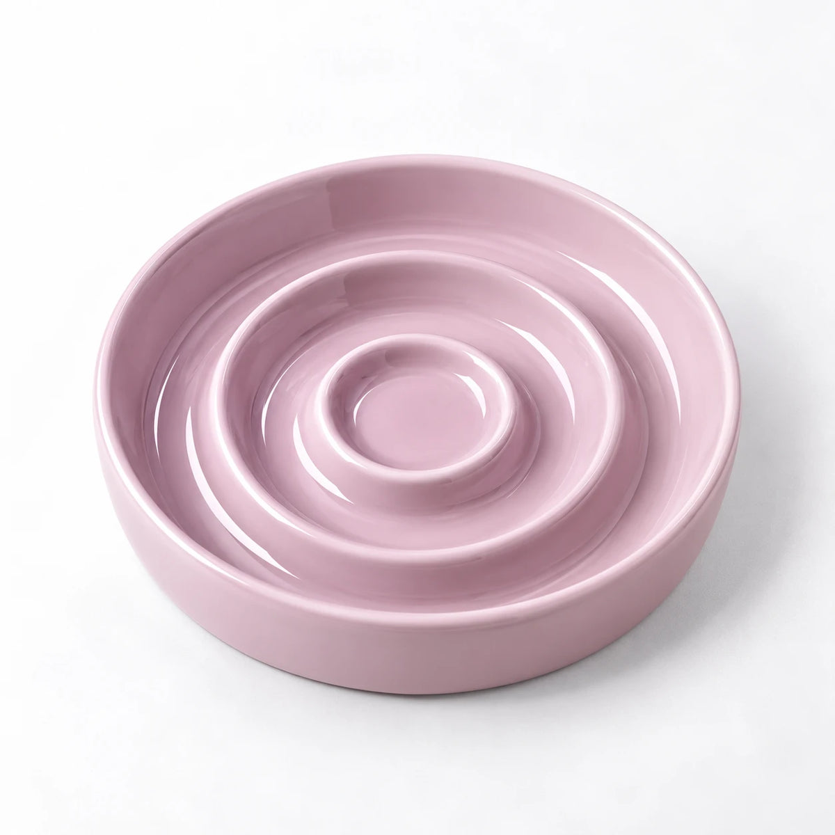 Gamelle anti-glouton rose à trois anneaux concentriques, vue de trois quarts